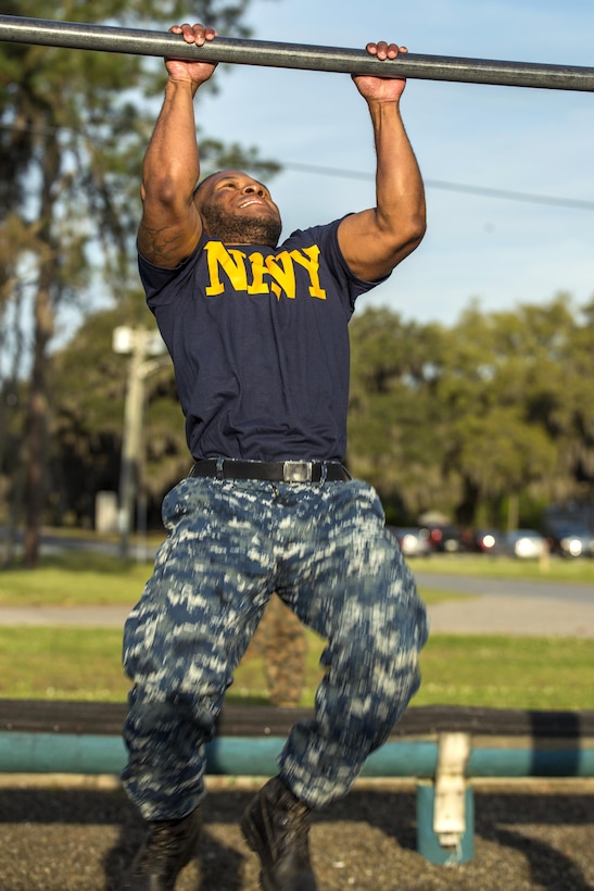 Navy Petty Officer 3rd Class Tyree J. Hood participates in the chin-up event during the Commanding General’s Fitness Cup challenge at Parris Island, S.C., March 25, 2016. Hood is assigned to the Parris Island Branch Medical Clinic. Marine Corps photo by Sgt. Jennifer Schubert
