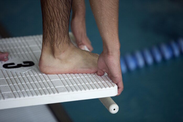 MARINE CORPS AIR STATION NEW RIVER, N.C. — A Marine with Wounded Warrior Battalion-East prepares to dive before a swim meet at Marine Corps Air Station New River Jan. 15. The camp was designed to prepare the athletes for the 2016 Marine Corps Trails which begin Feb. 28 at Marine Corps Base Camp Pendleton.