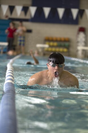 MARINE CORPS AIR STATION NEW RIVER, N.C. — Cpl. Alexander Salazar with Wounded Warrior Battalion-East swims the breast stroke during a swim meet at Marine Corps Air Station New River Jan. 15. “I love it,” said Salazar, a 22-year-old native of San Antonio, Texas who admitted to having chronic pain in his shoulder, knees and hips. “It’s easier to move around in the water. It’s easier on my body and to move around.”