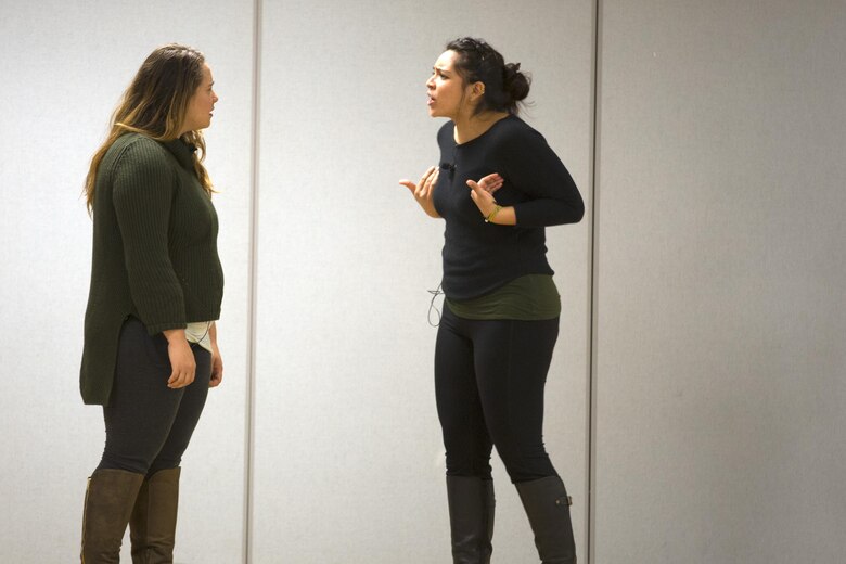 MARINE CORPS BASE CAMP LEJEUNE, N.C. — Victoria Williams and Briza Covarrubias, actresses with Pure Praxis, a performance troupe, perform at Camp Johnson, Marine Corps Base Camp Lejeune Jan. 28. The troupe performed a series of scenes to identify the difficulties a sexual assault victim may face and how service members can help.