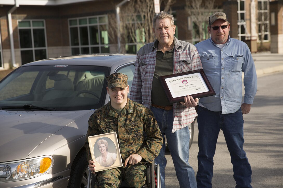 MARINE CORPS BASE CAMP LEJEUNE, N.C. — Sgt. Ivan Sears, with Wounded Warrior Battalion-East, was given a car by Martin Johnson, a Vietnam veteran and native of Maysville, at Marine Corps Base Camp Lejeune Feb. 17. Johnson donated the car, a 2003 Lincoln Towncar, in honor of his wife Fran, who passed away over year ago.