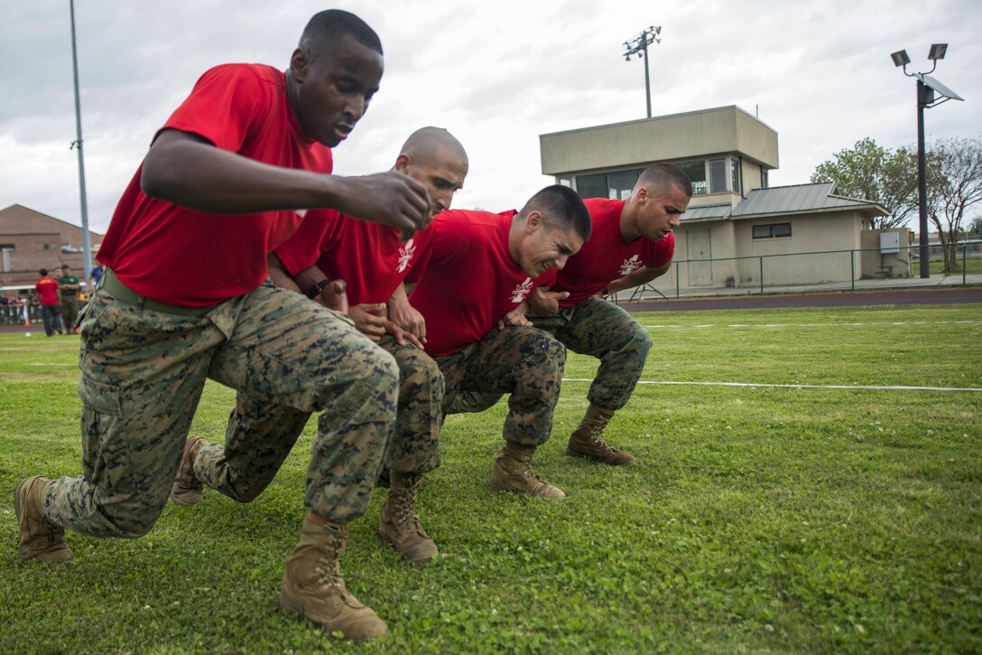 Marines compete in a deep knee-bend event during the Commanding General’s Fitness Cup Challenge at Marine Corps Recruit Depot Parris Island, S.C., March 25, 2016. The event tests the fitness of all commands at the depot. Marine Corps photo by Sgt. Jennifer Schubert