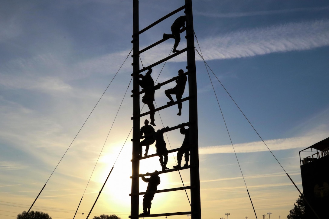 Paratroopers climb an obstacle during physical fitness training at Fort Bragg, N.C., March 24, 2016. The paratroopers are assigned to the 82nd Airborne Division’s 2nd Battalion, 505th Parachute Infantry Regiment, 3rd Brigade Combat Team. Army photo by Sgt. Anthony Hewitt