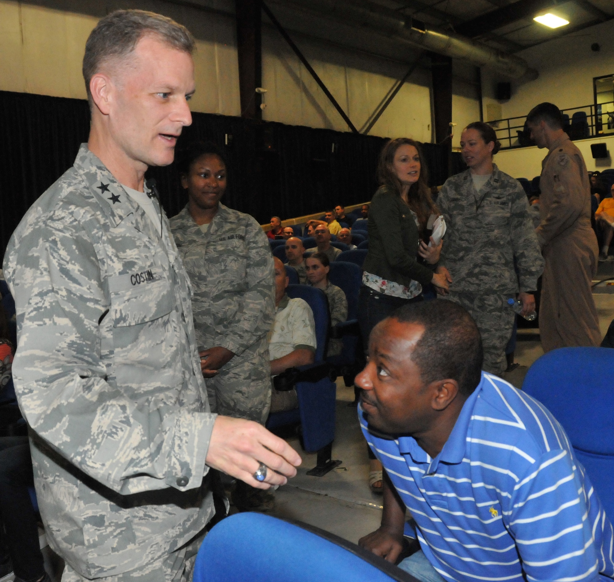 Chaplain (Maj. Gen.) Dondi Costin, Air Force Chief of Chaplains, greets service members March 27 at Al Udeid Air Base, Qatar. Costin preached at the combined Protestant Easter Sunday morning service held at a base theater. (U.S. Air Force photo by Tech. Sgt. Terrica Y. Jones)