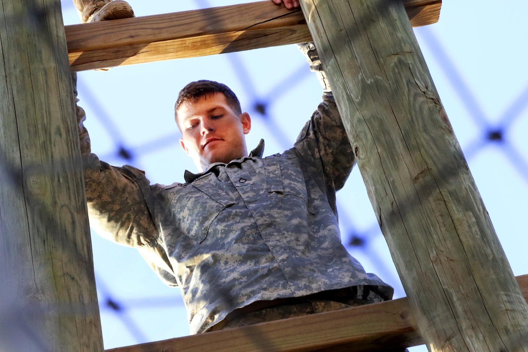 A paratrooper climbs a high ladder obstacle during physical fitness training at Fort Bragg, N.C., March 24, 2016. Army photo by Sgt. Anthony Hewitt