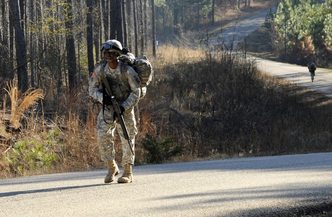 U.S. Army Sgt. Wayne Jones of Gainesville, Ga., a team leader with the 461st Human Resources Company, takes the lead in the 12-mile ruck march as part of the 642nd Regional Support Group's Best Warrior Competition at Fort McClellan, Ala., Feb. 19. (U.S. Army photo by Sgt. 1st Class Gary A. Witte, 642nd Regional Support Group)