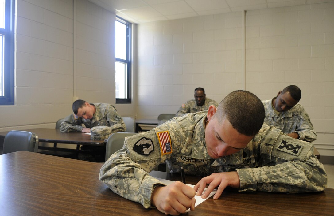 U.S. Army Reserve Soldiers write essays as part of the 642nd Regional Support Group's Best Warrior Competition at Fort McClellan, Ala., Feb. 18. The brigade-level competition tests the Soldiers' military skills, knowledge and fitness. (U.S. Army photo by Sgt. 1st Class Gary A. Witte, 642nd Regional Support Group)