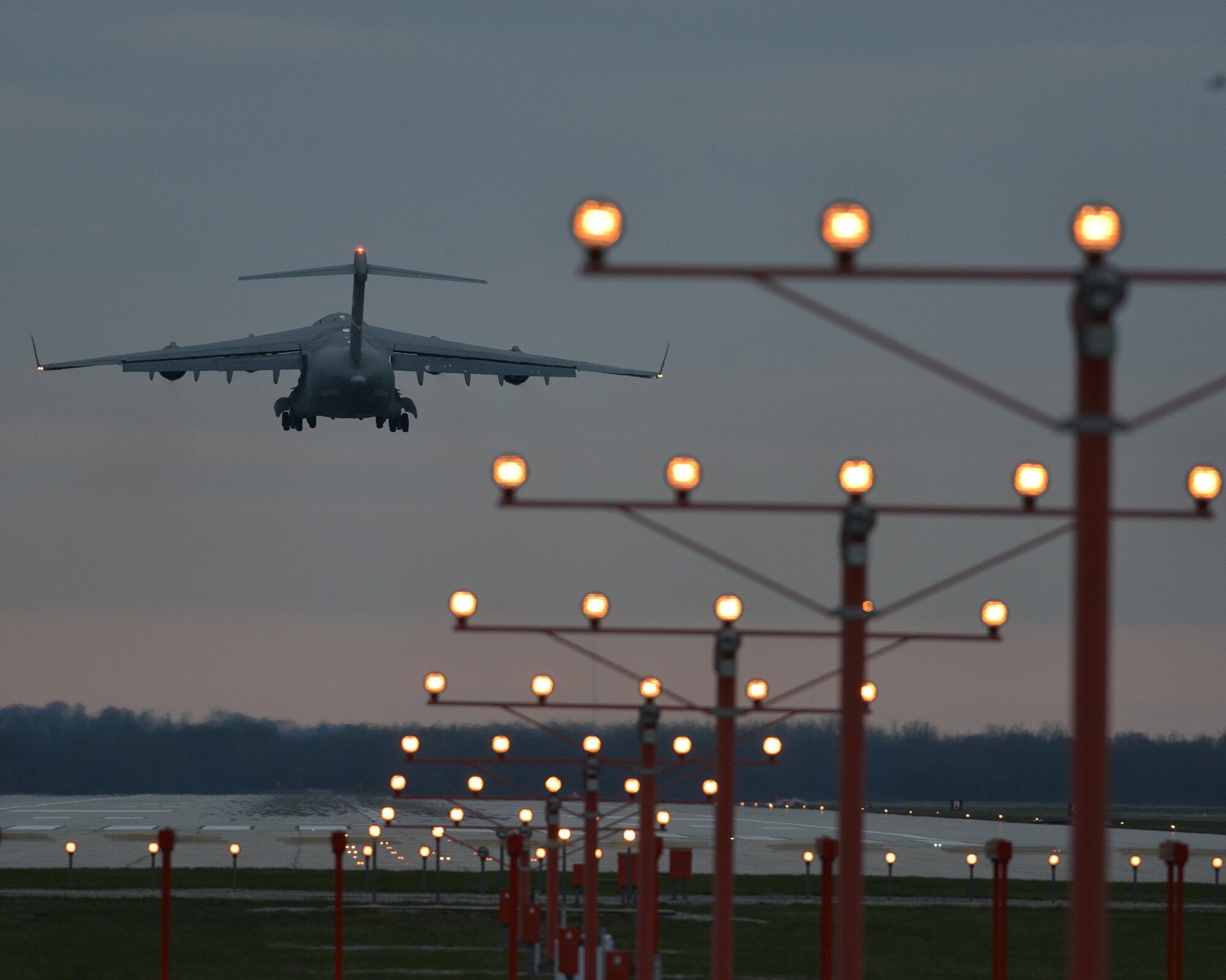 A 445th Airlift Wing C-17 Globemaster III takes to the sky for a local flight March 22, 2016 as the sun begins to set. (U.S. Air Force photo/Tech. Sgt. Frank Oliver)