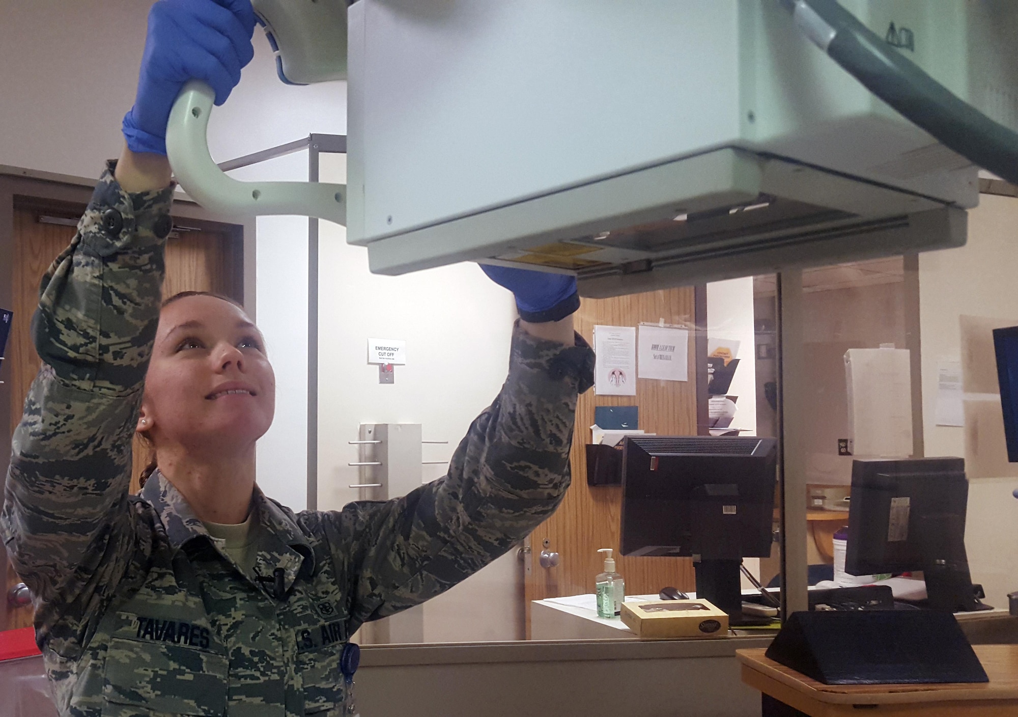 Senior Airman Meagan Tavares, 59th Medical Wing radiologic technologist, adjusts X-ray equipment at the Wilford Hall Ambulatory Surgical Center before seeing a patient. Tavares hopes to one day become a physician's assistant. (U.S. Air Force photo)