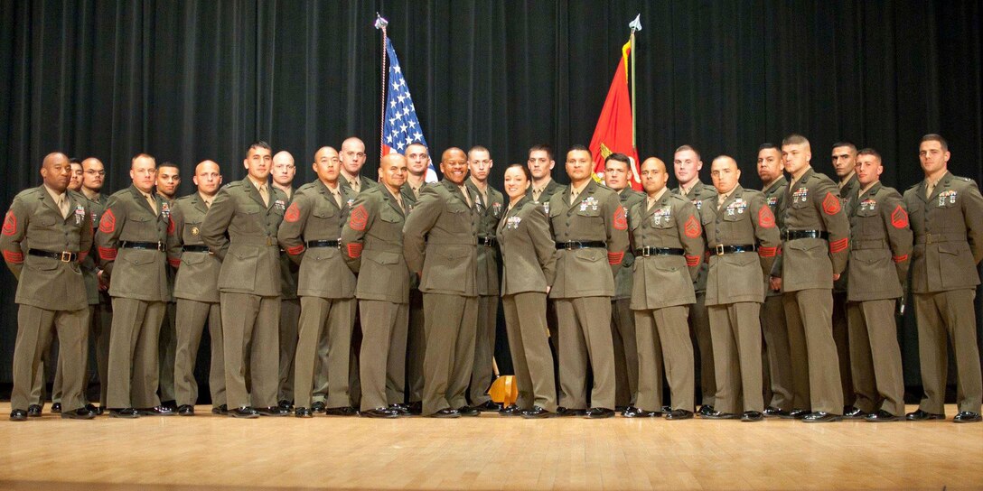 The leadership of Officer Candidates School and special guests attend a commissioning ceremony for Officer Candidate Class 221 at Little Hall aboard Marine Corps Base Quantico on March 26. The group takes the next step in their journey to be leaders of the Marine Corps. Leaders screen candidates for leadership requirements essential for commissioning as an officer.