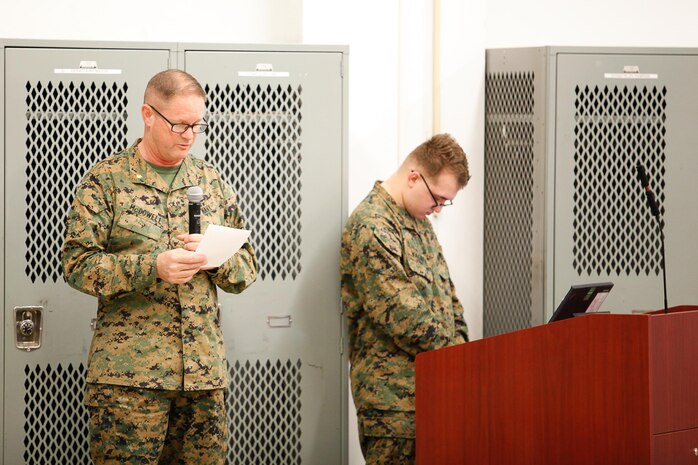 Lt. Cmdr. Mark A. McDowell, command chaplain with the Chemical Biological Incident Response Force (CBIRF), U.S. Marine Corps Forces Command (MARFOROM), leads CBIRF in a prayer during a CBIRF Basic Operations Course graduation ceremony at Naval Support Facility Indian Head, Md., Mar. 11, 2016. The course is a three-week program that provides approximately 145 hours of classroom, practical applications and individual and team testing in chemical, biological, radiological, nuclear, and high-yield explosive disciplines that meet federal requirements. After graduating the course, each Marine and sailor will be qualified to enter a contaminated area, search the area, provide emergency first aid and provide assistance to nonambulatory patients. Regardless of their jobs, or military occupational specialty, every Marine and sailor with CBIRF is required to complete the course, making the unit uniquely qualified to respond with minimal warning to a chemical, biological, radiological, nuclear or high-yield explosive (CBRNE) threat. (Official USMC Photos by Sgt. Jonathan S. Herrera/Released)