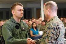 Chesapeake, Va.-native Lance Cpl. Ian N. Beck, infantryman and honor graduate, left, shakes hands with Col. Steve E. Redifer, commanding officer of the Chemical Biological Incident Response Force (CBIRF), U.S. Marine Corps Force Command (MARFORCOM), during a CBIRF Basic Operations Course graduation ceremony at Naval Support Facility Indian Head, Md., Mar. 11, 2016. The course is a three-week program that provides approximately 145 hours of classroom, practical applications and individual and team testing in chemical, biological, radiological, nuclear, and high-yield explosive (CBRNE) disciplines that meet federal requirements. After graduating the course, each Marine and sailor will be qualified to enter a contaminated area, search the area, provide emergency first aid and provide assistance to nonambulatory patients. Regardless of their jobs, or military occupational specialty, every Marine and sailor with CBIRF is required to complete the course, making the unit uniquely qualified to respond with minimal warning to a CBRNE threat. (Official USMC Photos by Sgt. Jonathan S. Herrera/Released)
