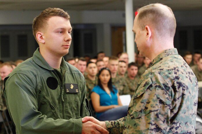 Chesapeake, Va.-native Lance Cpl. Ian N. Beck, infantryman and honor graduate, left, shakes hands with Col. Steve E. Redifer, commanding officer of the Chemical Biological Incident Response Force (CBIRF), U.S. Marine Corps Force Command (MARFORCOM), during a CBIRF Basic Operations Course graduation ceremony at Naval Support Facility Indian Head, Md., Mar. 11, 2016. The course is a three-week program that provides approximately 145 hours of classroom, practical applications and individual and team testing in chemical, biological, radiological, nuclear, and high-yield explosive (CBRNE) disciplines that meet federal requirements. After graduating the course, each Marine and sailor will be qualified to enter a contaminated area, search the area, provide emergency first aid and provide assistance to nonambulatory patients. Regardless of their jobs, or military occupational specialty, every Marine and sailor with CBIRF is required to complete the course, making the unit uniquely qualified to respond with minimal warning to a CBRNE threat. (Official USMC Photos by Sgt. Jonathan S. Herrera/Released)
