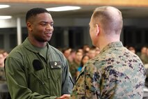 Riverdale, Ga.-native Pfc. Sandre E. Flournoy, logistics/embarkation specialist, left, shakes hands with Col. Steve E. Redifer, commanding officer of the Chemical Biological Incident Response Force (CBIRF), U.S. Marine Corps Force Command (MARFORCOM), during a CBIRF Basic Operations Course graduation ceremony at Naval Support Facility Indian Head, Md., Mar. 11, 2016. The course is a three-week program that provides approximately 145 hours of classroom, practical applications and individual and team testing in chemical, biological, radiological, nuclear, and high-yield explosive (CBRNE) disciplines that meet federal requirements. After graduating the course, each Marine and sailor will be qualified to enter a contaminated area, search the area, provide emergency first aid and provide assistance to nonambulatory patients. Regardless of their jobs, or military occupational specialty, every Marine and sailor with CBIRF is required to complete the course, making the unit uniquely qualified to respond with minimal warning to a CBRNE threat. (Official USMC Photos by Sgt. Jonathan S. Herrera/Released)
