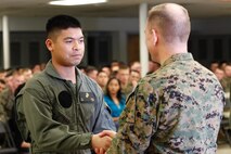 Norfolk, Va.-native Lance Cpl. Jason B. Embile, logistics/embarkation specialist, left, shakes hands with Col. Steve E. Redifer, commanding officer of the Chemical Biological Incident Response Force (CBIRF), U.S. Marine Corps Force Command (MARFORCOM), during a CBIRF Basic Operations Course graduation ceremony at Naval Support Facility Indian Head, Md., Mar. 11, 2016. The course is a three-week program that provides approximately 145 hours of classroom, practical applications and individual and team testing in chemical, biological, radiological, nuclear, and high-yield explosive (CBRNE) disciplines that meet federal requirements. After graduating the course, each Marine and sailor will be qualified to enter a contaminated area, search the area, provide emergency first aid and provide assistance to nonambulatory patients. Regardless of their jobs, or military occupational specialty, every Marine and sailor with CBIRF is required to complete the course, making the unit uniquely qualified to respond with minimal warning to a CBRNE threat. (Official USMC Photos by Sgt. Jonathan S. Herrera/Released)
