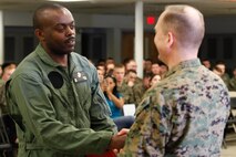 Baltimore-native Sgt. Magnus D. Nnolim, automotive maintenance technician, left, shakes hands with Col. Steve E. Redifer, commanding officer of the Chemical Biological Incident Response Force (CBIRF), U.S. Marine Corps Force Command (MARFORCOM), during a CBIRF Basic Operations Course graduation ceremony at Naval Support Facility Indian Head, Md., Mar. 11, 2016. The course is a three-week program that provides approximately 145 hours of classroom, practical applications and individual and team testing in chemical, biological, radiological, nuclear, and high-yield explosive (CBRNE) disciplines that meet federal requirements. After graduating the course, each Marine and sailor will be qualified to enter a contaminated area, search the area, provide emergency first aid and provide assistance to nonambulatory patients. Regardless of their jobs, or military occupational specialty, every Marine and sailor with CBIRF is required to complete the course, making the unit uniquely qualified to respond with minimal warning to a CBRNE threat. (Official USMC Photos by Sgt. Jonathan S. Herrera/Released)

