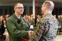 Manchester, Conn.-native Sgt. Kyle A. Phelps, a small arms repair/technician, left, shakes hands with Col. Steve E. Redifer, commanding officer of the Chemical Biological Incident Response Force (CBIRF), U.S. Marine Corps Force Command (MARFORCOM), during a CBIRF Basic Operations Course graduation ceremony at Naval Support Facility Indian Head, Md., Mar. 11, 2016. The course is a three-week program that provides approximately 145 hours of classroom, practical applications and individual and team testing in chemical, biological, radiological, nuclear, and high-yield explosive (CBRNE) disciplines that meet federal requirements. After graduating the course, each Marine and sailor will be qualified to enter a contaminated area, search the area, provide emergency first aid and provide assistance to nonambulatory patients. Regardless of their jobs, or military occupational specialty, every Marine and sailor with CBIRF is required to complete the course, making the unit uniquely qualified to respond with minimal warning to a CBRNE threat. (Official USMC Photos by Sgt. Jonathan S. Herrera/Released)

