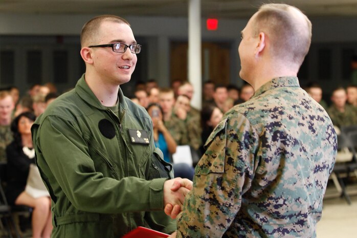 Manchester, Conn.-native Sgt. Kyle A. Phelps, a small arms repair/technician, left, shakes hands with Col. Steve E. Redifer, commanding officer of the Chemical Biological Incident Response Force (CBIRF), U.S. Marine Corps Force Command (MARFORCOM), during a CBIRF Basic Operations Course graduation ceremony at Naval Support Facility Indian Head, Md., Mar. 11, 2016. The course is a three-week program that provides approximately 145 hours of classroom, practical applications and individual and team testing in chemical, biological, radiological, nuclear, and high-yield explosive (CBRNE) disciplines that meet federal requirements. After graduating the course, each Marine and sailor will be qualified to enter a contaminated area, search the area, provide emergency first aid and provide assistance to nonambulatory patients. Regardless of their jobs, or military occupational specialty, every Marine and sailor with CBIRF is required to complete the course, making the unit uniquely qualified to respond with minimal warning to a CBRNE threat. (Official USMC Photos by Sgt. Jonathan S. Herrera/Released)
