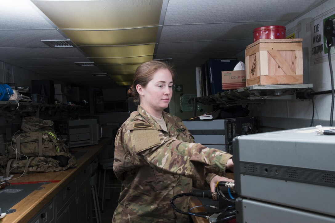 Army Spc. Selena Landers operates a radio test set at Camp Buehring, Kuwait, March 23, 2016. Landers is a radio communications and security repairer assigned to Company B, 640th Aviation Support Battalion, 40th Combat Aviation Brigade. Landers has a degree in cultural anthropology and plans to apply for Officer Candidate School after returning home from deployment. Army photo by Staff Sgt. Ian M. Kummer