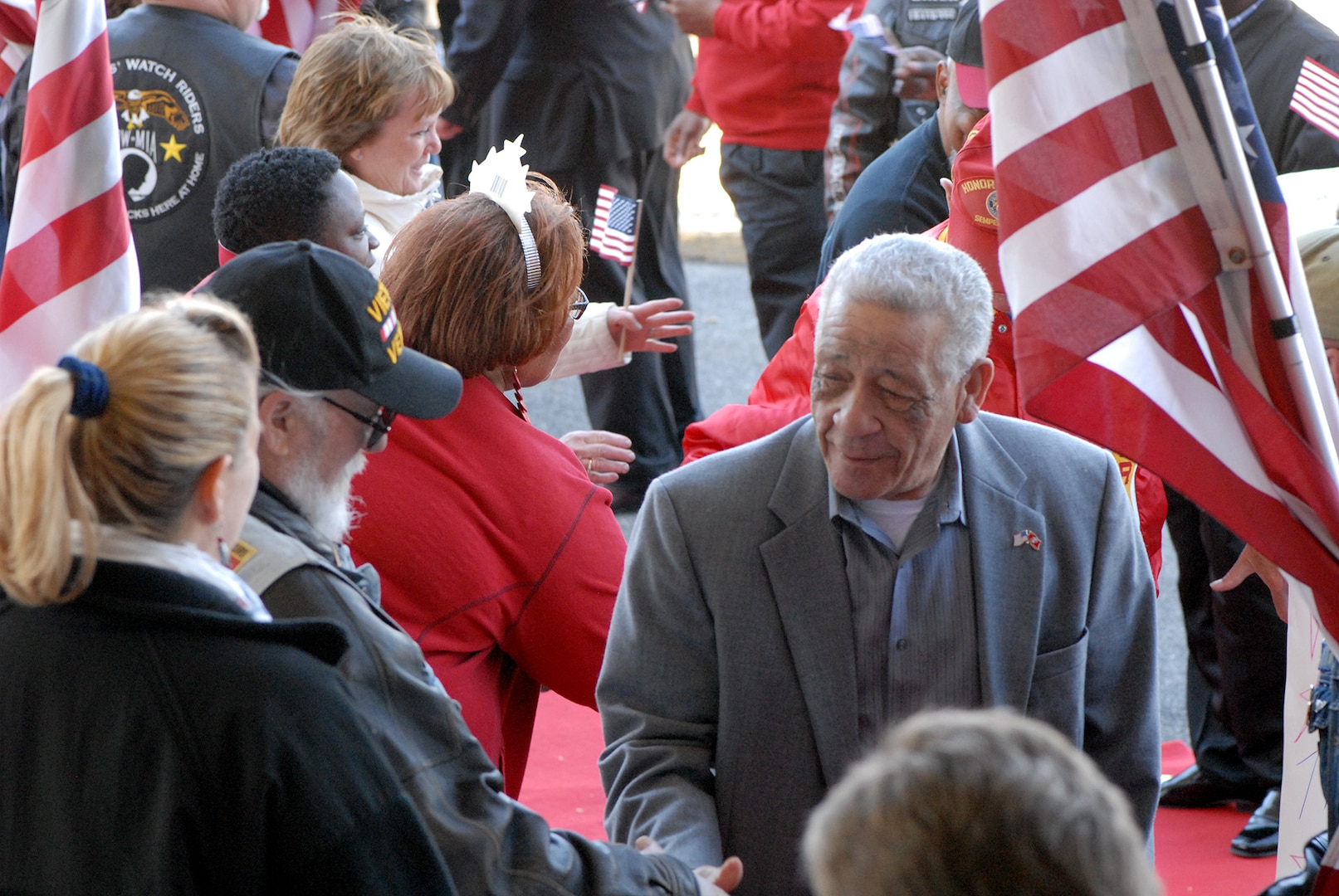 Vietnam War veterans are cheered on by volunteers as they parade down a red-carpet into a Vietnam War Commemoration program March 29, 2016 at the Pennsylvania National Guard Armory in Philadelphia, PA. More than 400 Vietnam War era veterans attended the event sponsored by the Association of the United States Army and Vietnam War Commemoration partners Defense Logistics Agency Troop Support and the Corporal Michael J. Crescenz Veterans Affairs Medical Center.