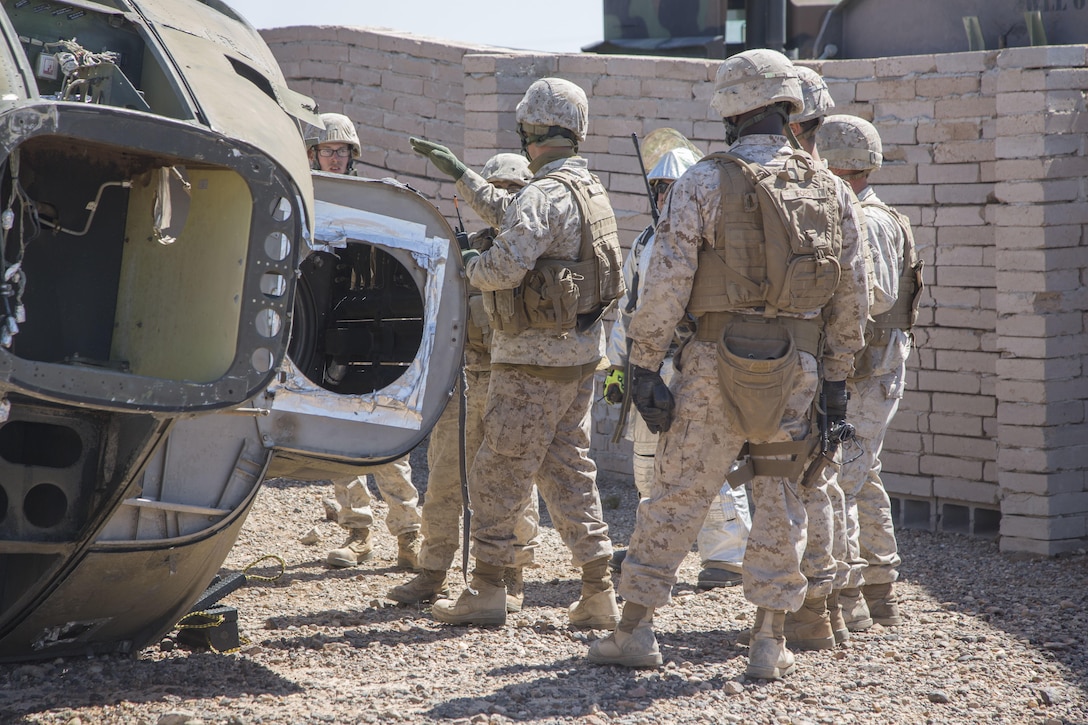 Marines prepare to conduct an aircraft salvage as part of a Weapons and Tactics Instructor course at K-9 Village, Yuma Proving Grounds, Yuma, Ariz., March 30, 2016. Marine Corps photo by Lance Cpl. Anabel Abreu-Rodriguez