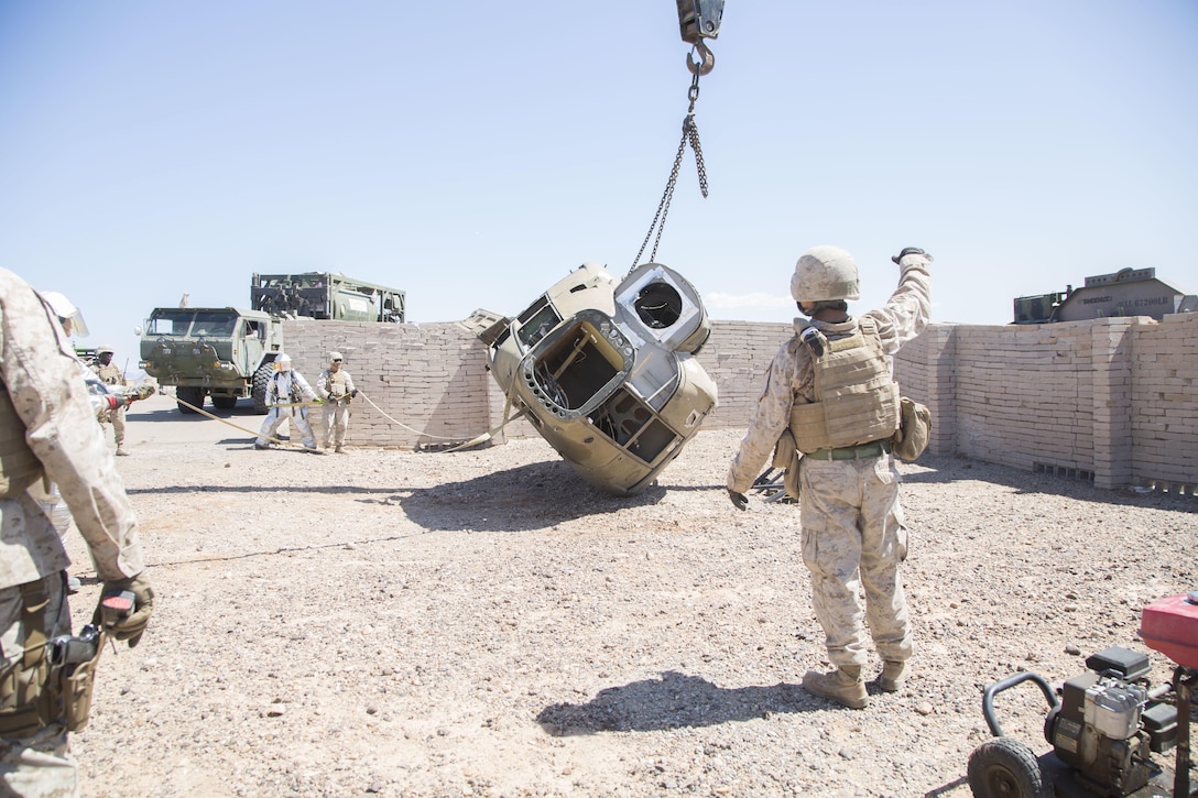 Marines conduct an aircraft salvage exercise during a Weapons and Tactics Instructor course at K-9 Village, Yuma Proving Grounds, Yuma, Ariz., March 30, 2016. Marine Corps photo by Lance Cpl. Anabel Abreu-Rodriguez 
