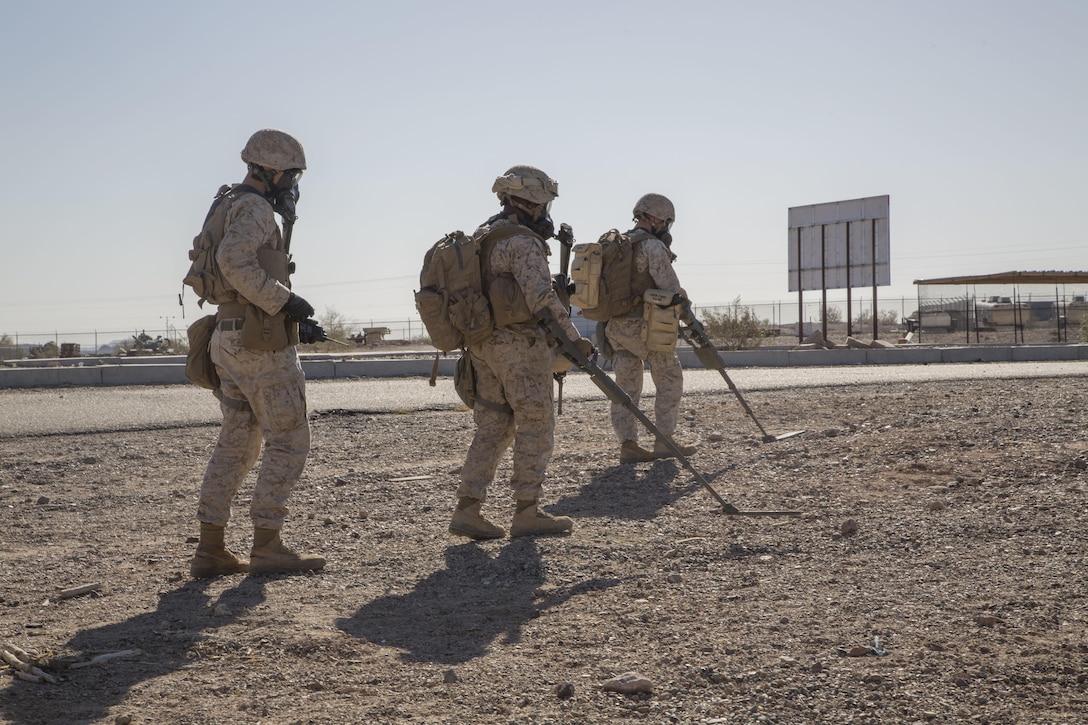 Marines conclude the exercise by sweeping the area during a Weapons and Tactics Instructor course at K-9 Village, Yuma Proving Grounds, Yuma, Ariz., March 30, 2016. Marine Corps photo by Lance Cpl. Anabel Abreu-Rodriguez 