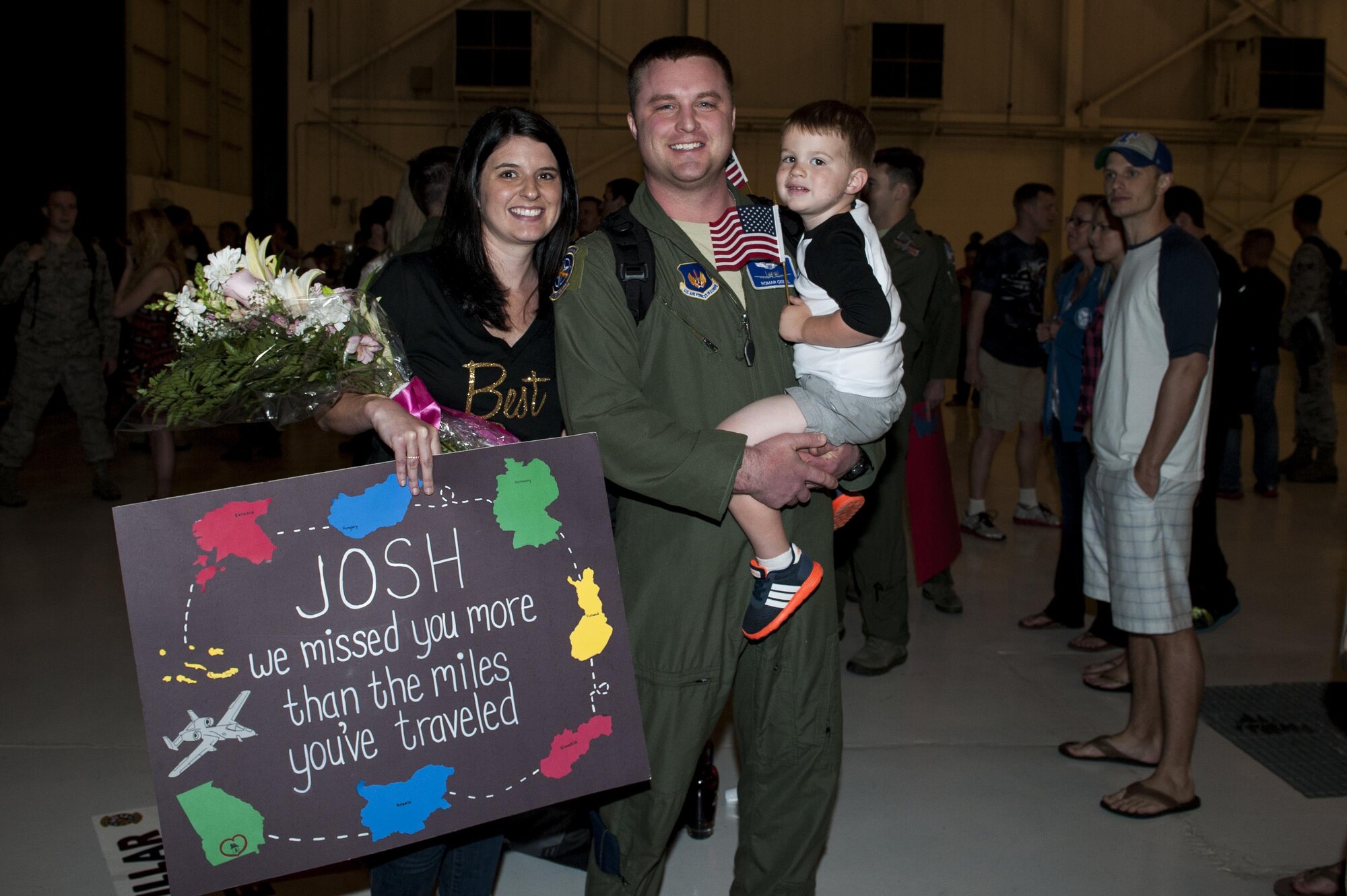 U.S. Air Force Capt. Joshua Geidel, 74th Expeditionary Fighter Squadron current operations flight commander, poses for a photo with his wife, Courtney, and son, Graham, March 30, 2016, at Moody Air Force Base, Ga. Geidel returned home from a six-month deployment in Eastern Europe in support of Operation Atlantic Resolve. (U.S. Air Force photo by Airman 1st Class Lauren M. Hunter/Released)