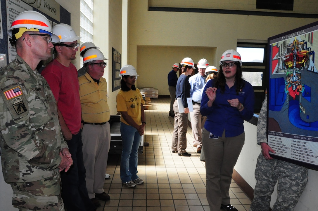 Maj. Gen. Donald Jackson, U.S. Army Corps of Engineers deputy commanding general for Civil and Emergency Operations, and the students look at the Center Hill Power House from the observation deck.  Loren McDonald, project manager and assistant program manager for the Nashville District Section 212 Program, explained to the group how a turbine and generator function. 