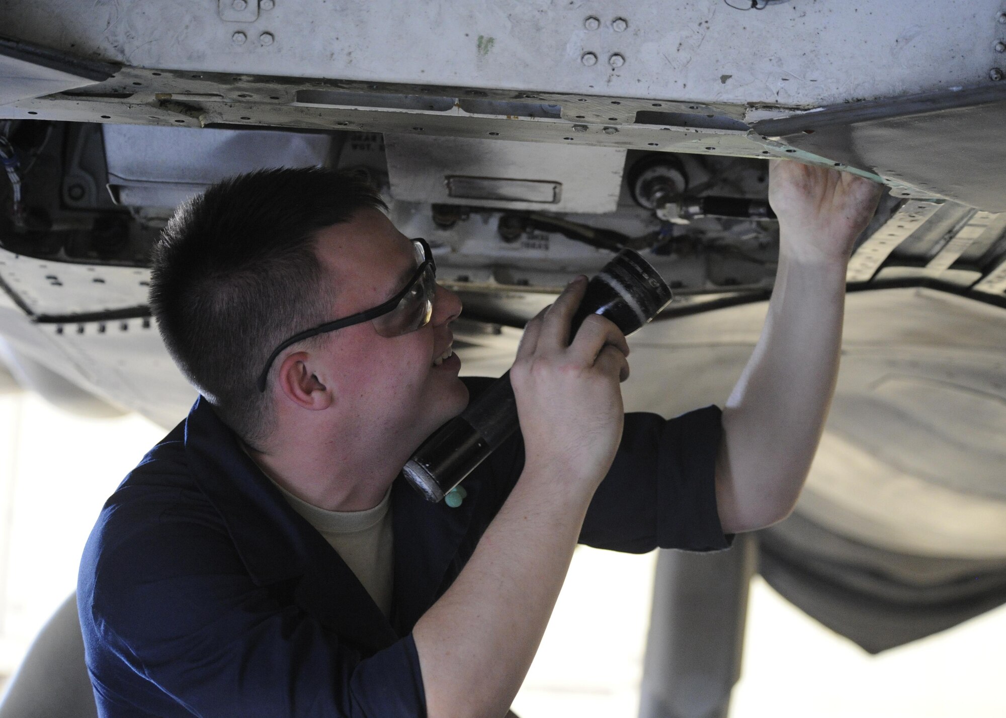 Senior Airman Jackson Findley, 325th Maintenance Squadron package maintenance plans technician, inspects the F-22 Raptor aircraft mounted assisted drive, March 28, 2016, in Hangar 2. Package maintenance plans technicians like Findley are charged with checking F-22s AMADs for any defects or wear and tear. (U.S. Air Force photo by Senior Airman Solomon Cook/Released)