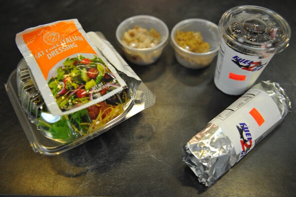 Aderholt Fitness Center’s “Fuel 2 Go” snack bar offers a variety of wraps, salads and parfaits at Hurlburt Field, Fla., March 30, 2016. “Fuel 2 Go” is a joint initative offered by the bowling alley and fitness center for Airmen to choose healthier food options on-the-go. (U.S. Air Force photo by Airman 1st Class Joseph Pick)
