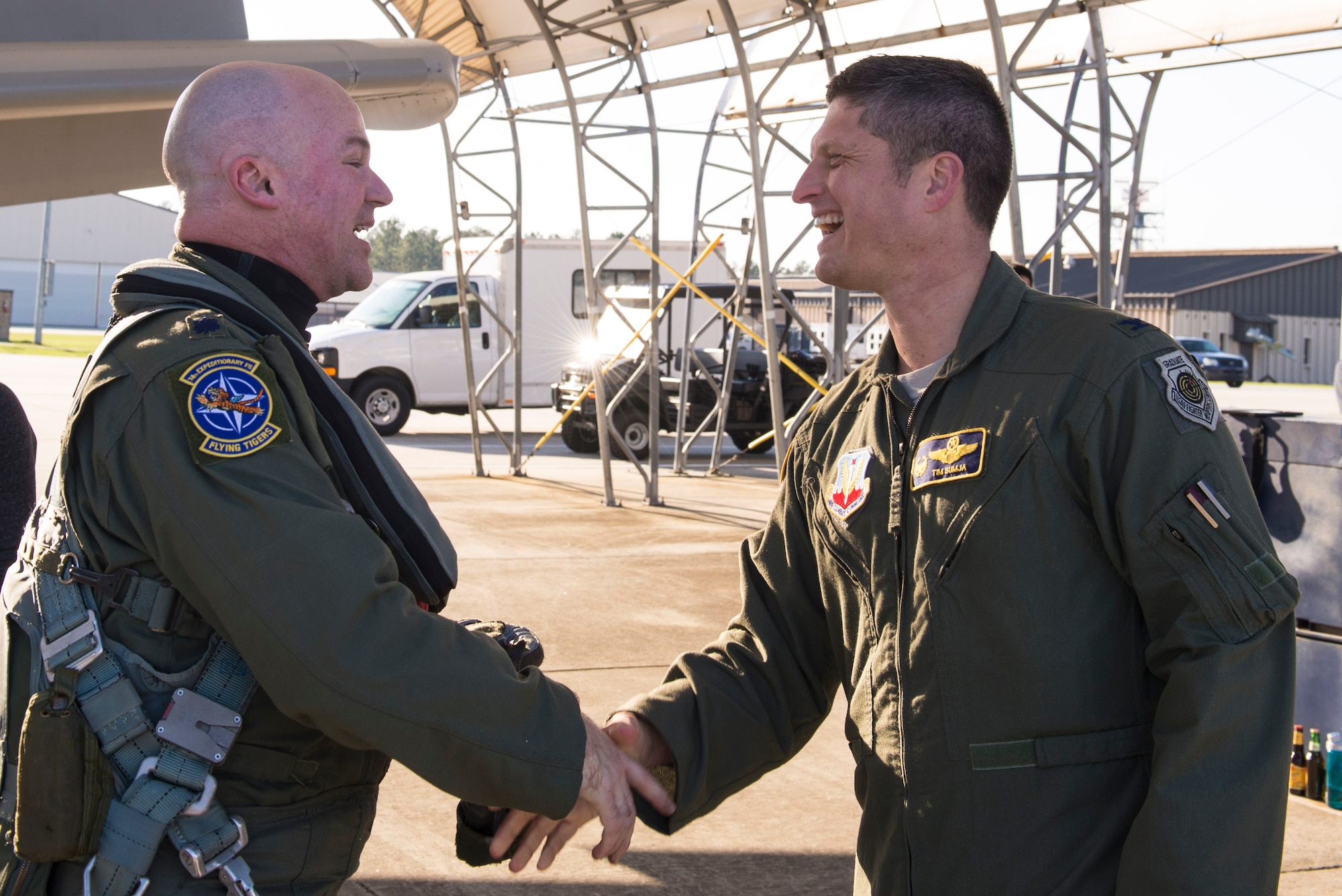 U.S. Air Force Col. Timothy Sumja, 23d Fighter Group commander, greets Lt. Col. Bryan France, 74th Expeditionary Fighter Squadron commander, as he returns from a deployment, March 21, 2016, at Moody Air Force Base, Ga. The 74th EFS deployed for six months to train alongside NATO allies to enhance correspondence and exhibit U.S. allegiance in the safeguarding and steadfastness of Europe. (U.S. Air Force photo by Airman 1st Class Greg Nash/Released) 