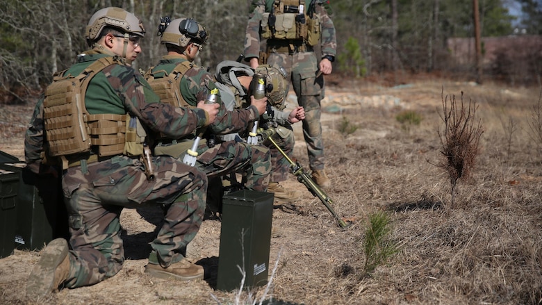 Marine Raiders from Company F, 2d Marine Raider Battalion, honed their skills shooting 60 mm mortars during a Company Collective Exercise in Fort Bragg, South Carolina, Feb. 25, 2016. The Marine Special Operations Company and individual teams where tested on their execution of basic skills as well as learned and honed new tactic, techniques and procedures.