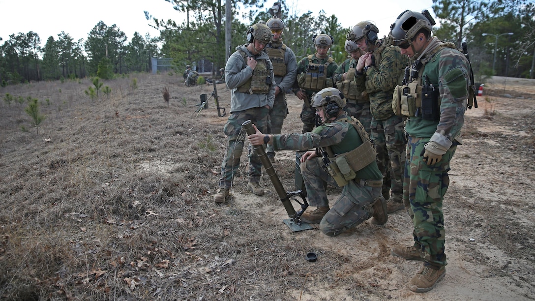 Marines Raiders from Company F, 2d Marine Raider Battalion, honed their skills shooting 60 mm mortars during a Company Collective Exercise in Fort Bragg, South Carolina, Feb. 25, 2016. The Marine Special Operations Company and individual teams where tested on their execution of basic skills as well as learned and honed new tactic, techniques and procedures.