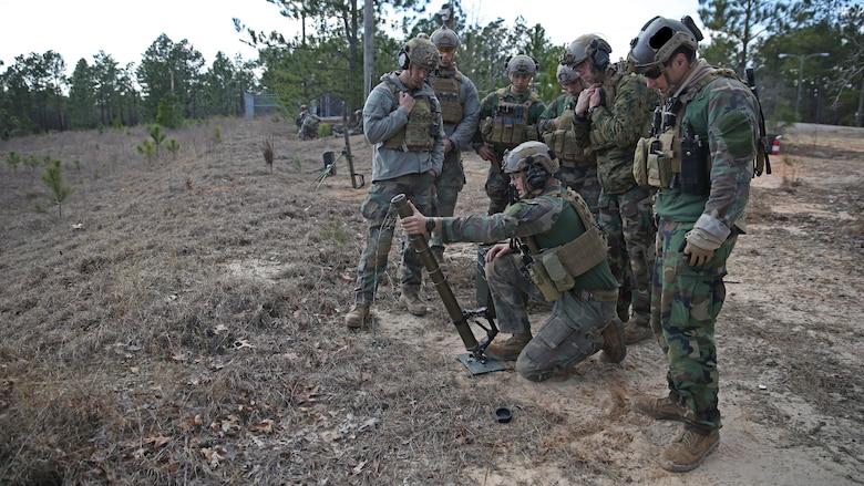Marines Raiders from Company F, 2d Marine Raider Battalion, honed their skills shooting 60 mm mortars during a Company Collective Exercise in Fort Bragg, South Carolina, Feb. 25, 2016. The Marine Special Operations Company and individual teams where tested on their execution of basic skills as well as learned and honed new tactic, techniques and procedures.