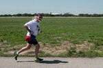 Curtis Sparrow, Air Force Personnel Operations Agency computer system administrator, runs along Perimeter Road March 31, 2016 at Joint Base San Antonio-Randolph. Sparrow runs six days a week averaging 160 miles a month and has finished first in his age group during the first two JBSA Half Marathons.