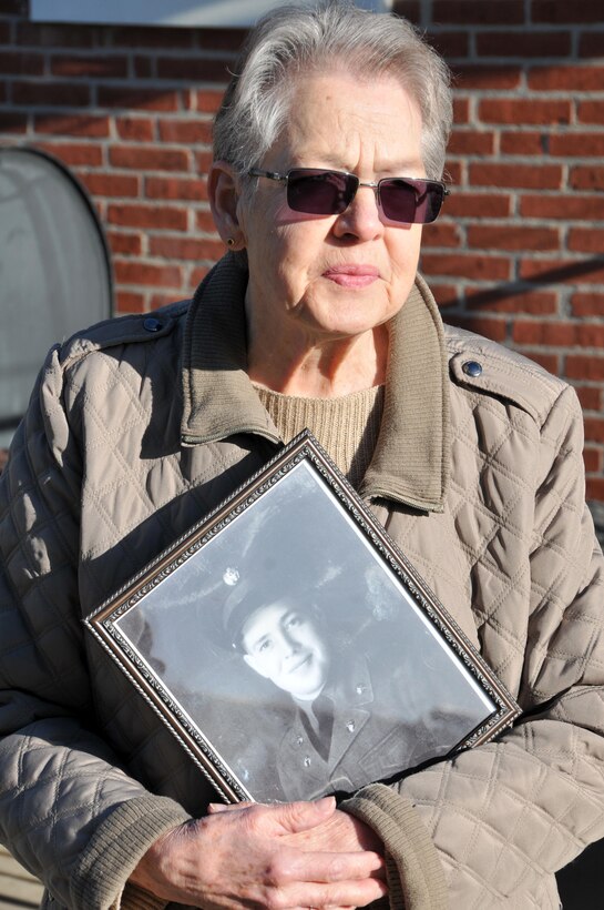 Urbana Warfel, sister of Sgt. Wilson Meckley Jr., holds a picture of her brother prior to a ceremony March 29 in which the family was awarded Meckley's Purple Heart.  Meckley was considered Missing in Action on Dec. 2, 1950 near the Chosin Reservoir, North Korea during the Korean War. On April 9, 2015, repatriated remains from the battlefield were analyzed, identifying them as Meckley's.
