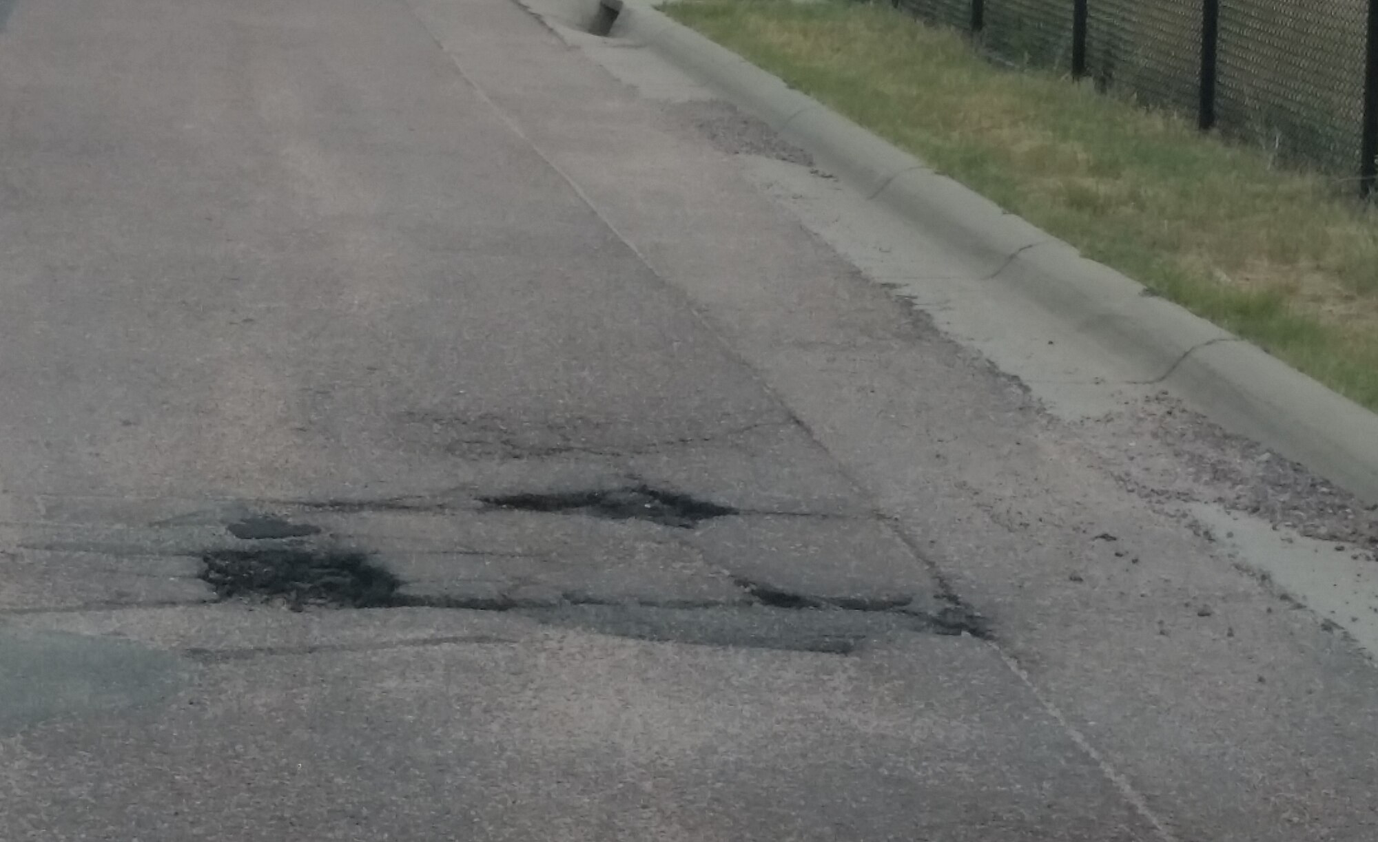 Civil engineers at the Air Force Academy are asking drivers to report potholes and road damage. (Courtesy photo)
