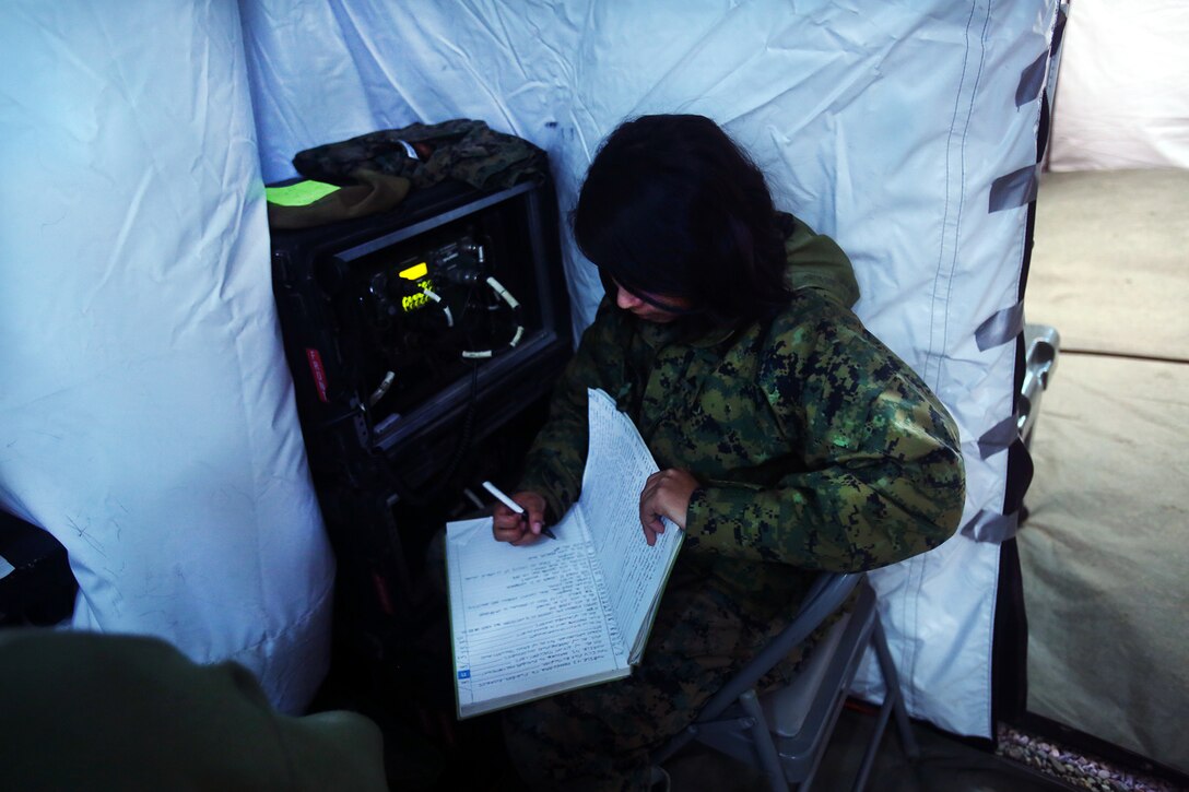 A field radio operator logs in a convoy movement during a cold weather training exercise at the Mountain Warfare Training Center in Bridgeport, Calif., March 17, 2016. The Marine, a field radio operator with Headquarters and Support Company, 7th Engineer Support Battalion, 1st Marine Logistics Group, was among 90 Marines with 7th ESB who served as the logistics combat element in support of 2nd Battalion, 4th Marine Regiment, 1st Marine Division, during Mountain Exercise 6-16, Feb. 24- March 26, 2016. (U.S. Marine Corps photo by Sgt. Laura Gauna/released)