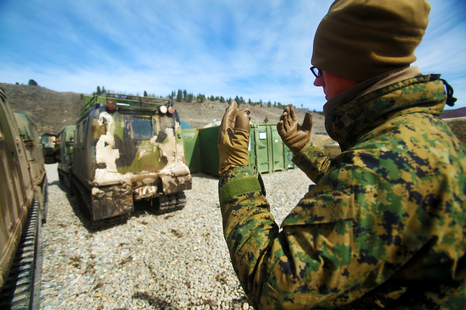 U.S. Marine Cpl. Matthew McGill guides a small unit support vehicle (SUSV) during a cold weather training exercise at the Mountain Warfare Training Center in Bridgeport, Calif., March 17, 2016. McGill, a heavy equipment operator with Alpha Company, 7th Engineer Support Battalion, 1st Marine Logistics Group, was among 90 Marines with 7th ESB who served as the logistics combat element in support of 2nd Battalion, 4th Marine Regiment, 1st Marine Division, during Mountain Exercise 6-16, Feb. 24- March 26, 2016. (U.S. Marine Corps photo by Sgt. Laura Gauna/released)