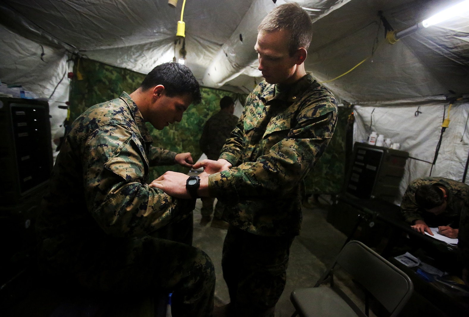 U.S. Marine Cpl. Matthew Sandal is treated for a back injury during a cold weather training exercise at the Mountain Warfare Training Center in Bridgeport, Calif., March 17, 2016. Sandal, a heavy equipment operator with Alpha Company, 7th Engineer Support Battalion, 1st Marine Logistics Group, was among 90 Marines with 7th ESB who served as the logistics combat element in support of 2nd Battalion, 4th Marine Regiment, 1st Marine Division, during Mountain Exercise 6-16, Feb. 24- March 26, 2016. (U.S. Marine Corps photo by Sgt. Laura Gauna/released)