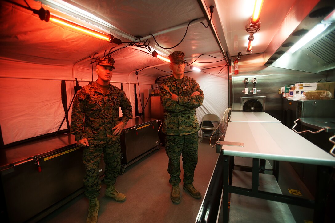 U.S. Marines Lt. Gen. David H. Berger and Sgt. Maj. Bradley Kasal learn about the expeditionary field kitchen during a cold weather training exercise at the Mountain Warfare Training Center in Bridgeport, Calif., March 17, 2016. Berger is the commanding general and Kasal is the sergeant major of I Marine Expeditionary Force. Approximately 90 Marines with 7th Engineer Support Battalion, 1st Marine Logistics Group, served as the logistics combat element in support of 2nd Battalion, 4th Marine Regiment, 1st Marine Division, during Mountain Exercise 6-16, Feb. 24- March 26, 2016. (U.S. Marine Corps photo by Sgt. Laura Gauna/released)
