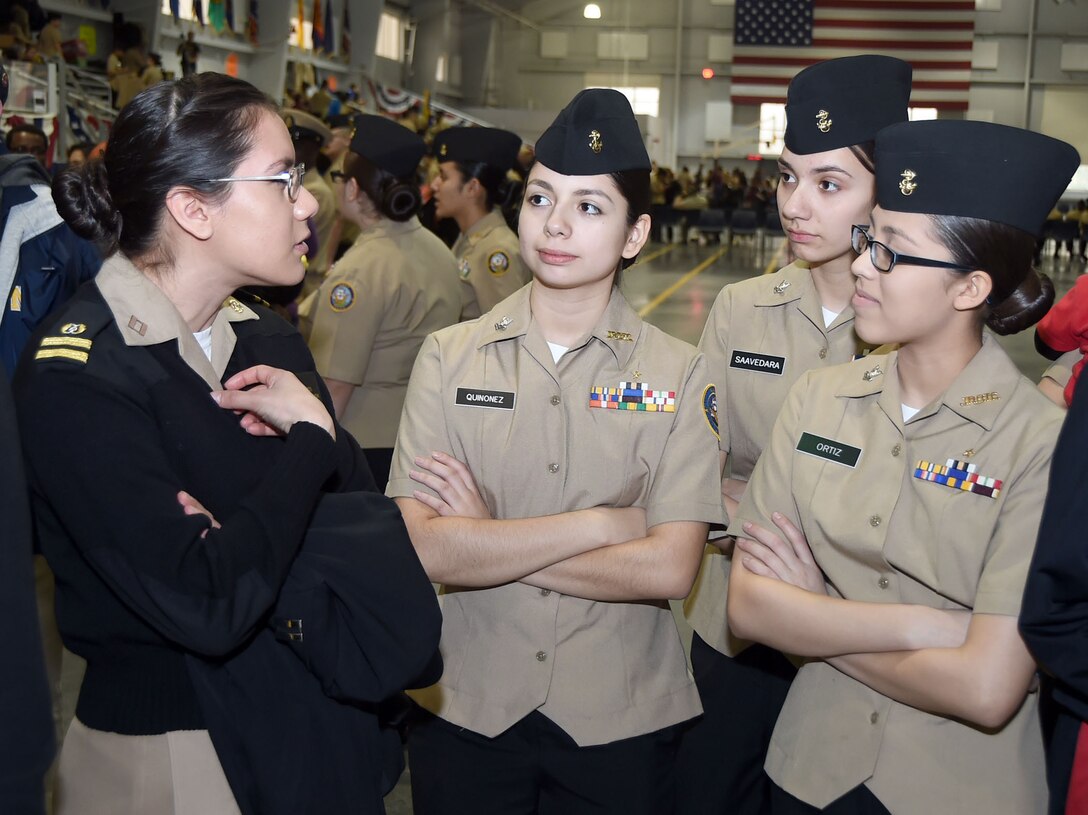 Navy Lt. Kimberly Rios talks with Navy Junior ROTC cadets from East Aurora (Ill.) High School at the 2016 Navy Junior ROTC Area 3 West regional academic, athletic and drill competition in the Pacific Fleet ceremonial drill hall at Recruit Training Command, Naval Station Great Lakes, Ill.,, Feb. 8, 2016. Navy photo by Scott A. Thornbloom 