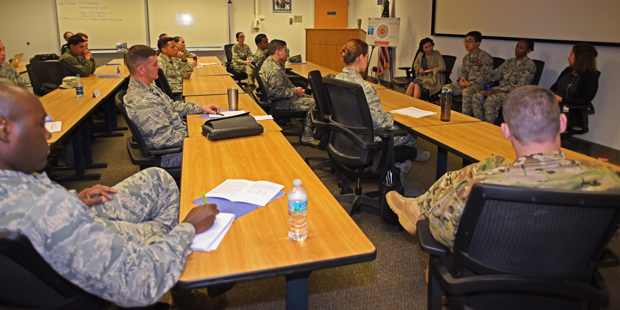 Airmen 1st Class Woo Jin Eum and Naomi Muhura, language and culture advisors at the United States Air Force Special Operations School, sit on a panel of language and culture experts during a course at Hurlburt Field, Fla., March 31, 2016. Eum and Muhura are in the Military Accessions Vital to the National Interest (MAVNI) program. They teach, interpret and translate their native languages as needed, enabling the Air Force Special Operations Command mission. (U.S. Air Force photo/Staff Sgt. Melanie Holochwost)