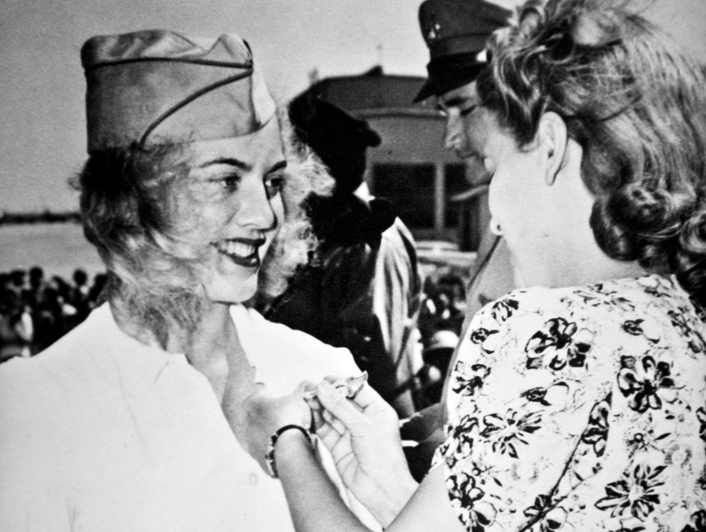 Betty Blake received her flying wings from Women Airforce Service Pilots co-originator Jacqueline Cochran, a pioneer of American aviation, on April 24, 1943, during the graduation ceremony of the first 23 W.A.S.P pilots. (U.S. Air Force photo by Tech. Sgt. Bennie J. Davis III)