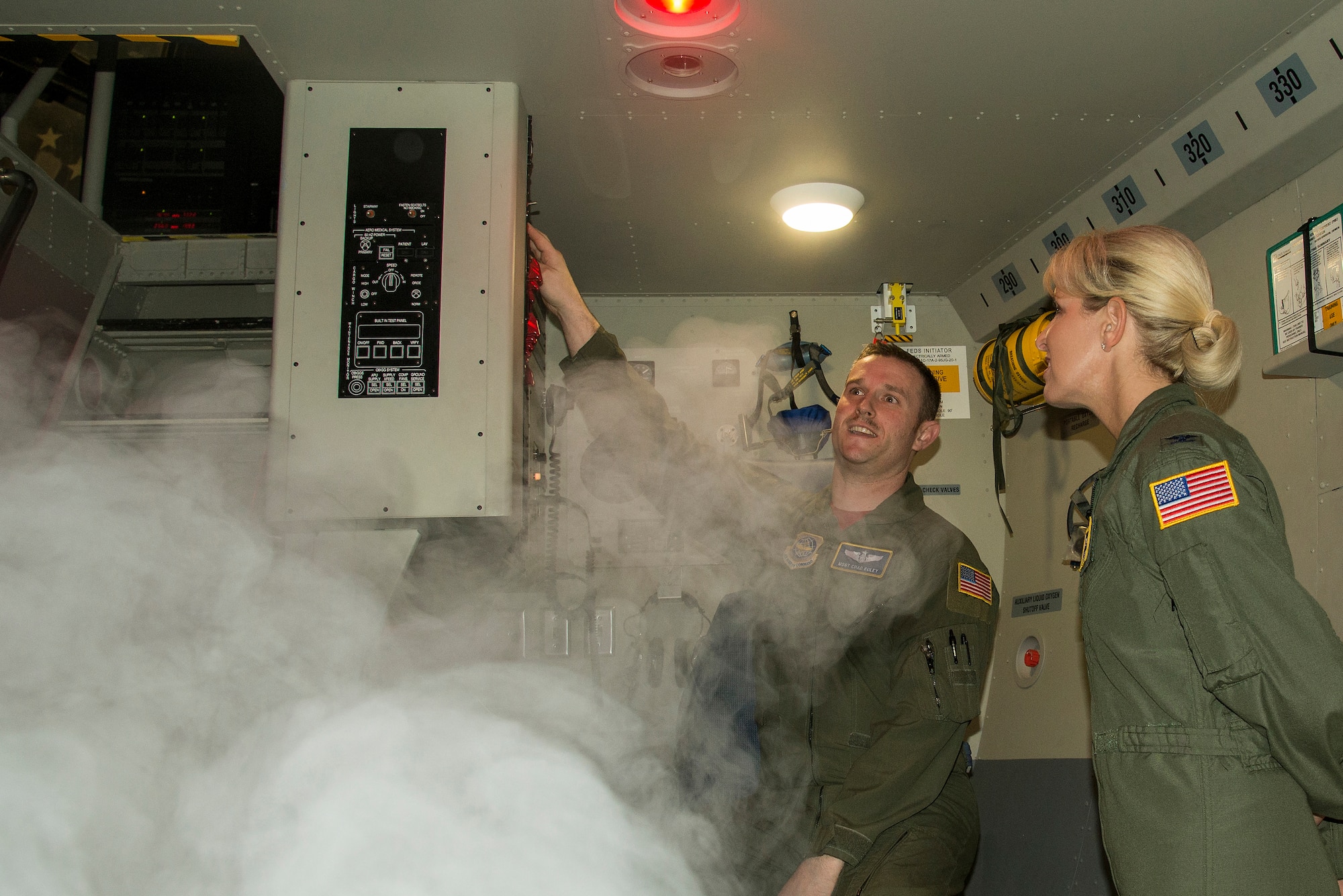 Master Sgt. Chad Boley, Detachment 4 operations flight chief, explains a C-17 simulator operation to Col. Laura Lenderman, 375th AMW commander, March 18, 2016, during a tour of Det. 4 at Wright-Patterson Air Force Base, Ohio. The simulator helps provide aircrew and maintenance training, combat-ready pilots, loadmasters and maintenance technicians along with upgrade qualification training. (U.S. Air Force Photo by Airman Daniel Garcia)