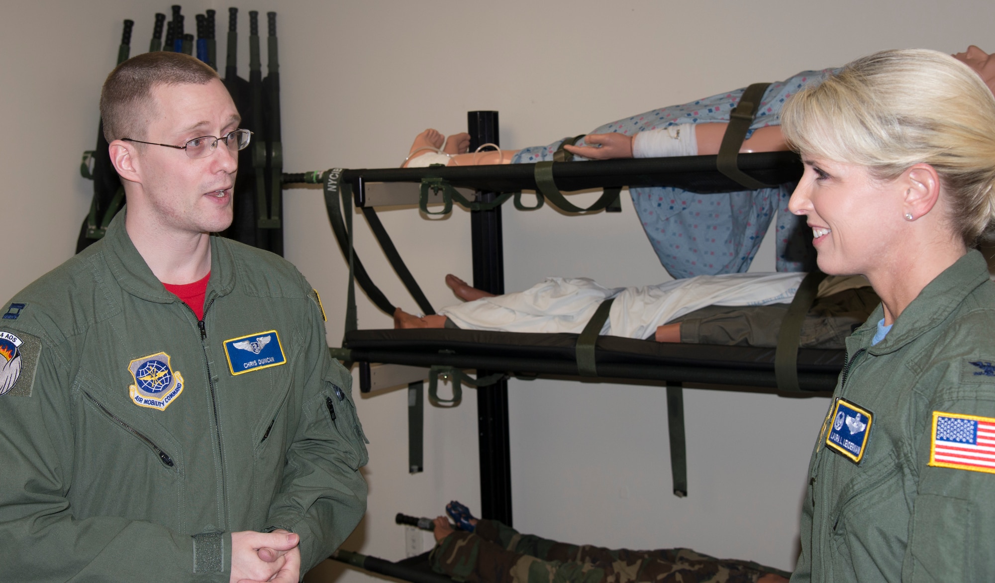 Capt. Christopher Duncan, Detachment 4 Operations Group flight nurse instructor, explains the purpose of the Boyscout room during a visit to Wright-Patterson Air Force Base, Ohio, March 18, 2016. The Boyscout room is an auxillary room used to place certain equipment and supplies prior to students' evaluation phases. This includes the crew's emergency equipment litter as well as medication kits and their solution bags. This is important because our students need all of these supplies to execute an aeromedical evacuation mission, said Duncan. (U.S. Air Force Photo by Airman Daniel Garcia)