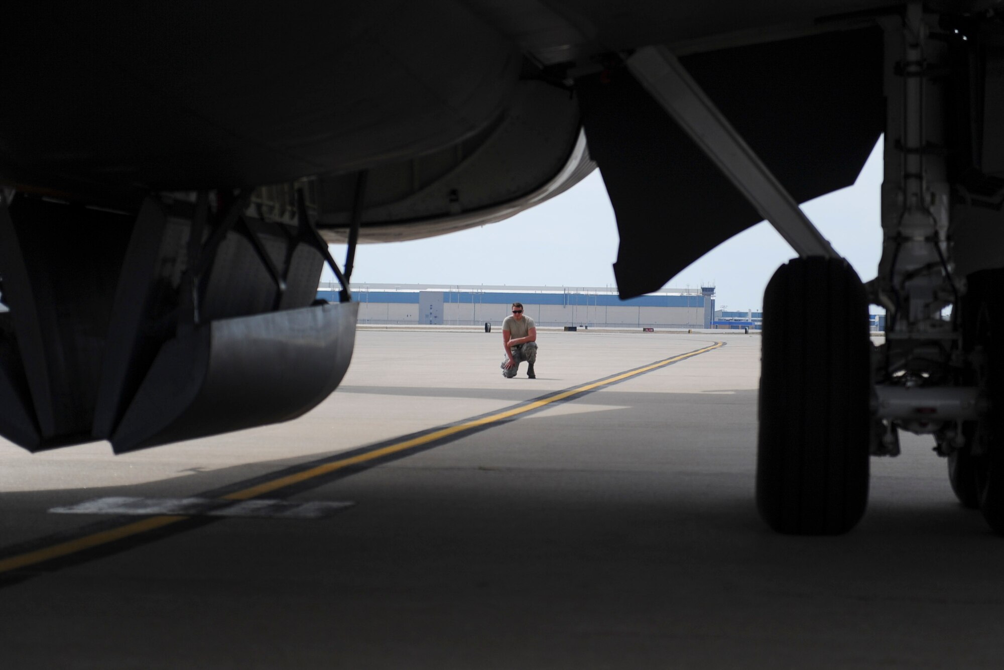 Airman 1st Class Garrett Jornov, 22nd Aircraft Maintenance Squadron crew chief, waits for clearance to tow a KC-135 Stratotanker to a different parking spot, March 29, 2016, at McConnell Air Force Base, Kan. Maintenance Airmen prepare the aircraft to be moved at their own pace, but they must coordinate with the aircraft control tower and the maintenance operations center before the towing can actually begin. (U.S. Air Force photo/Senior Airman Victor J. Caputo)
