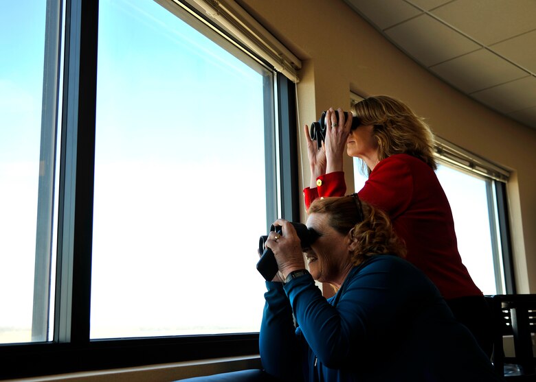 Lisa Disbrow, Undersecretary of the Air Force, top, and North Dakota U.S. Senator Heidi Heitkamp, right, views the flight line and the Grand Sky area during a base tour on March 30, 2016, at Grand Forks Air Force Base, N.D. The base tour consisted of Radar Approach Control (RAPCON) tower and a Block 40 RQ-4 Global Hawk brief. (U.S. Air Force photo by Senior Airman Xavier Navarro)