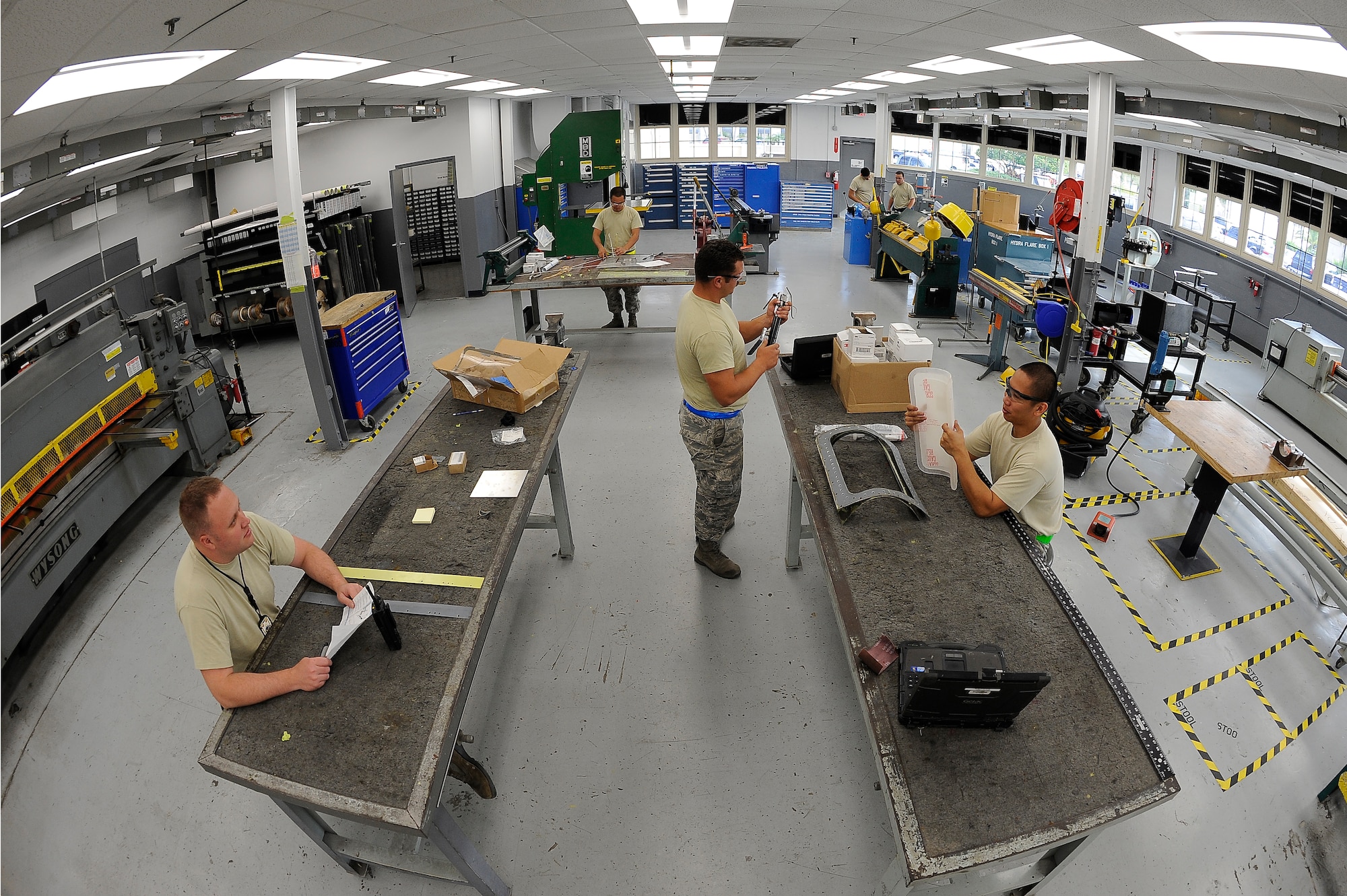 Airmen from the fabrication flight assigned to the 6th and 927th Maintenance Squadron fabricate parts March 23, 2016, at MacDill Air Force Base, Fla. Structural maintenance Airmen are responsible for fabricating parts and repairing the aircraft in order to keep the KC-135 Stratotanker mission-ready. (U.S. Air Force photo by Airman 1st Class Mariette Adams)